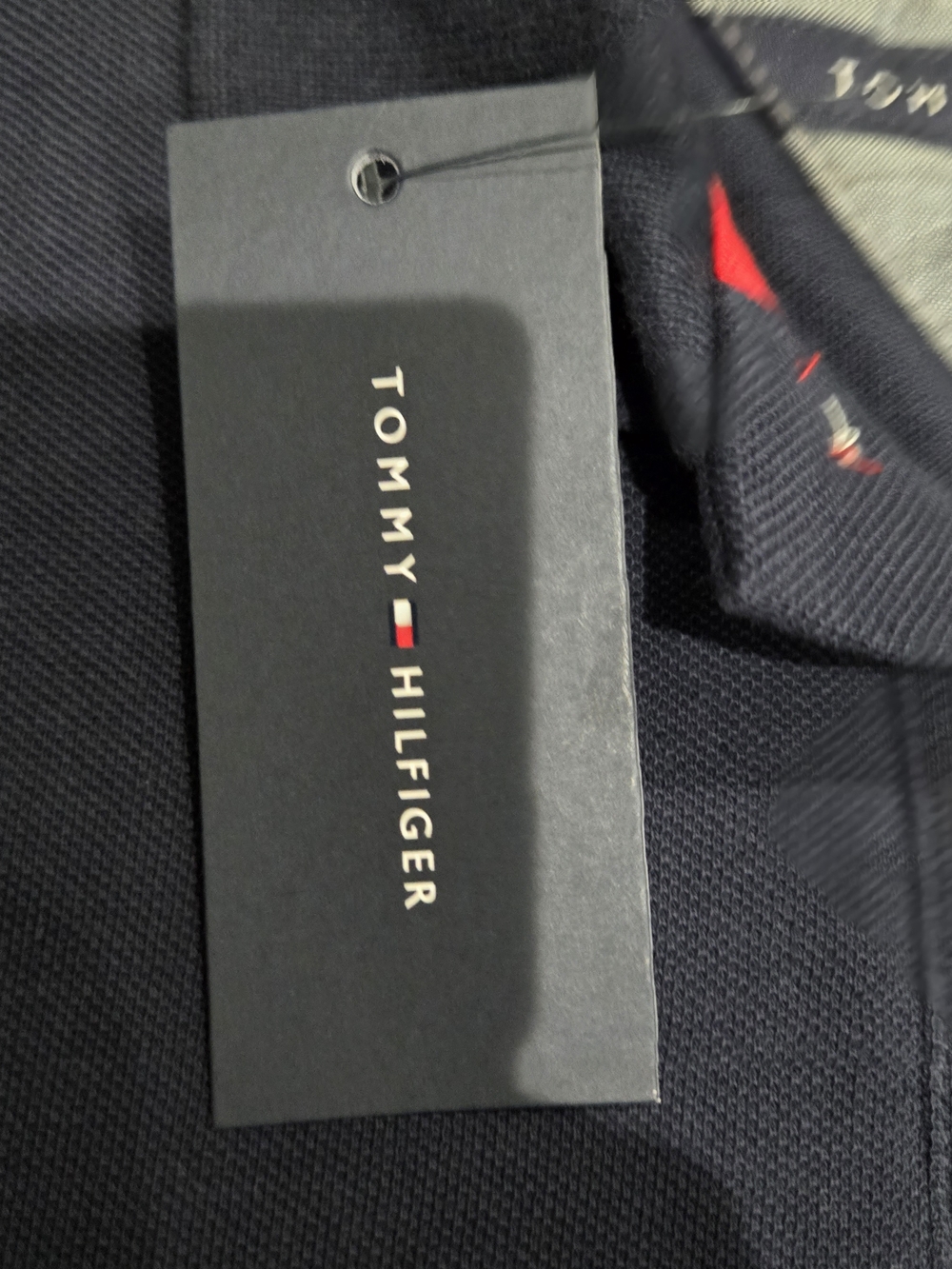 Tommy Hilfiger Navy Polo with White Lettering and Red Logo - Picture 6 of 7